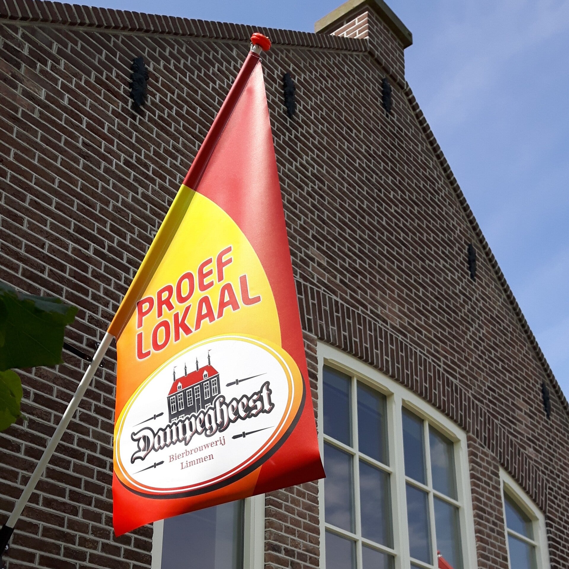 The Dampegheest tasting room with the brewery flag