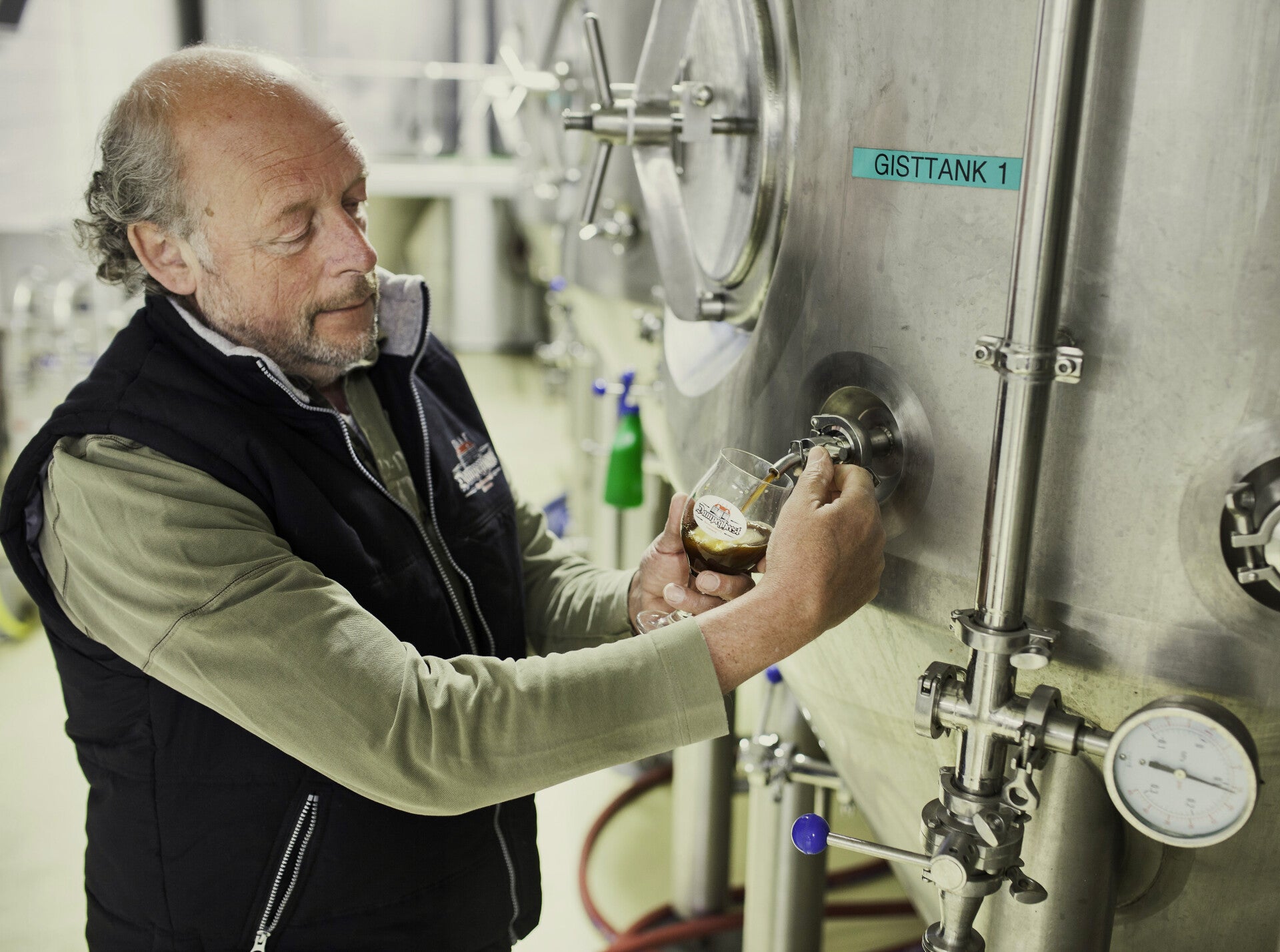 A Dampegheest brewer beside the fermentation tank in Limmen